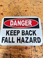 Front view of entire sign showing message and mounting holes