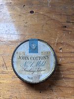 Top view of John Cotton's tobacco tin showing full label