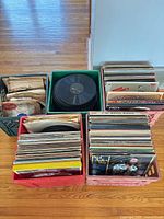 Four crates of records with LPs, 78s, sleeves visible