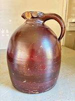 Front view of reddish-brown stoneware jug