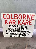 Front view of full sign showing text and condition