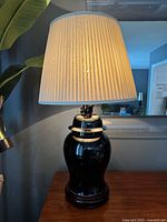 Full view of lamp with shade illuminated