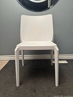 Front view of white Pedrali chair