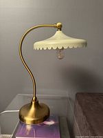 Full view of lamp, shade, stem, base and bulb