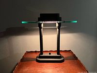 Front view of lamp on wooden surface illuminated