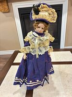 Front view of doll displaying full outfit and accessories