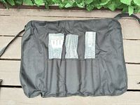 Front view of roll case holding three bubble-wrapped tools