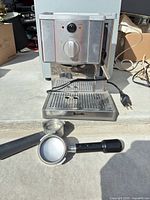 Front view of Breville ESP8XL machine with power cord and accessories shown