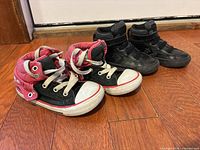 Front angled view of both pairs showing styles, colors and condition