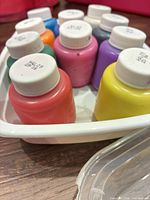 Ten Crayola paint bottles in white tray