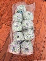 Bag containing 10 skeins of pastel variegated yarn