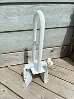 Full view of safety rail showing clamp and grab bar