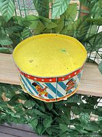 Full view of top of drum with lid on showing yellow lid surface