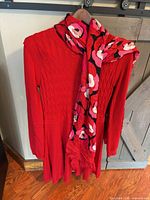 Dress and scarf displayed together on hanger