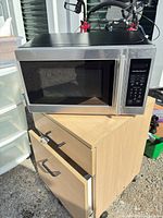 Front and side view of Hamilton Beach EM720CPN-S microwave on cart