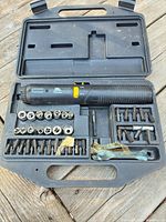 Entire kit in open case showing screwdriver, sockets, bits, wrenches