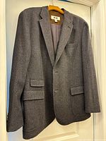 Front view of gray tweed Joseph Abboud sport coat on hanger