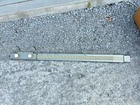 Full length view of KnitKing flatbed knitting machine bed on ground