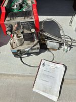Espresso machine with pump, portafilter, manual visible