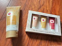 Full lot: body cream tube and boxed hand cream trio