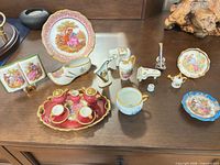 Group shot of all porcelain miniatures on dresser