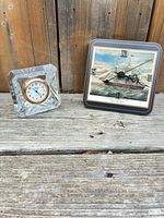 Both clocks side by side showing relative size and design
