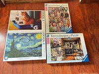 All four puzzle boxes arranged on floor