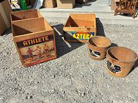 group shot showing two crates and two pails with labels