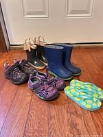 All five pairs of toddler footwear lined up