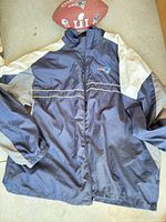 Full view of jacket front alongside football