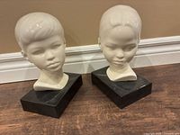 Both ceramic bust bookends side by side