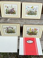 Four placemats displayed with box lid and insert