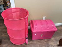Overall view of mesh hamper and plastic bin side by side