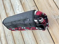 Blanket rolled with attached zippered pouch shown