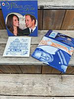 Overview of all three souvenir items: book, tile/coaster, packaged tea towel