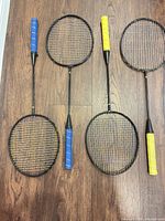 All four badminton rackets layout showing grips and frames