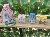 Group shot of all four ceramic house votive holders