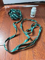 Harness, leash and Catit Catnip Bubbles grouped on floor