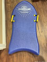 Full view of blue Snowboogie Thunder foam sled showing overall shape and condition