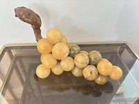Entire grape cluster sculpture angled view