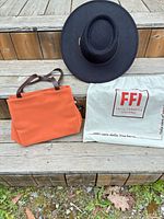 Hat, tote bag and dust bag group shot