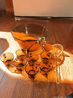 Full set: bowl, eight cups, ladle