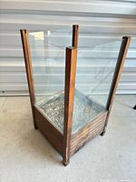 Full view of planter showing wood frame and glass sides