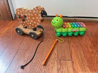 Wooden pull sheep, caterpillar xylophone with mallet overall view