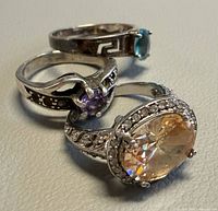 Group of three sterling silver gemstone rings