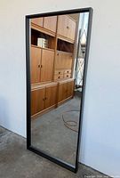 Front view reflecting room, shows black frame and overall size