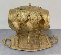 Full view of dispenser, cups hanging, tray visible