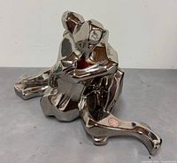 Front oblique view of platinum-plated cubist lovers sculpture