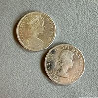 Both coins obverse side showing Queen Elizabeth II portraits