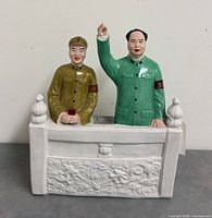 Front view of ceramic figurine showing both leaders and decorative base